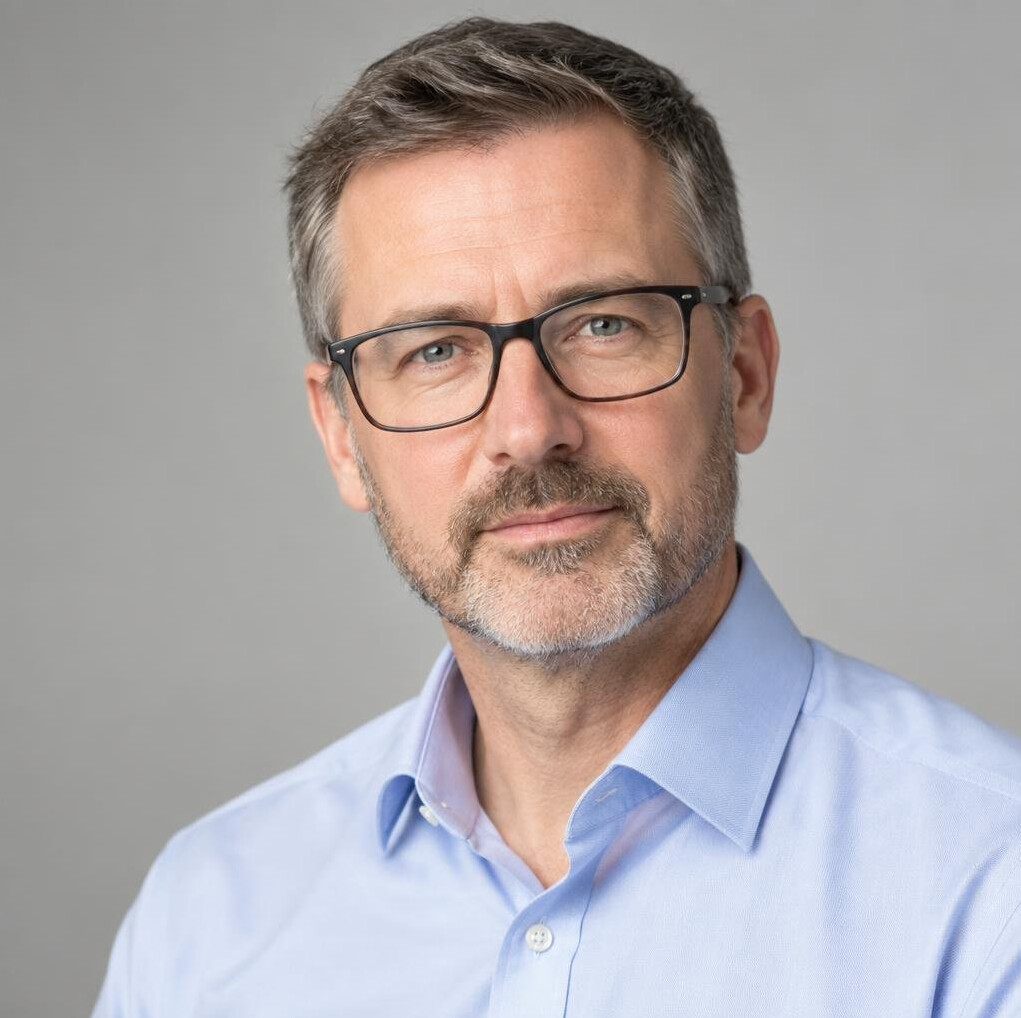 Portrait of a white British man, standards and compliance editor, professional headshot